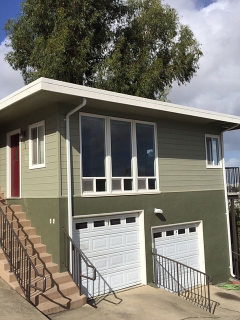 Stand alone unit, no shared walls. Garage on bottom of unit.