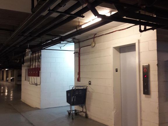 The elevator in the building basement/garage. Laundry room i