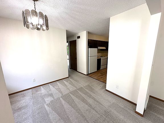 Dining near Kitchen. Hall to Bath and Bedrooms.
