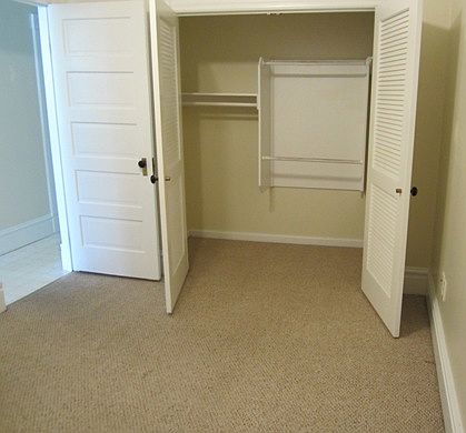 Bedroom closet and door to kitchen