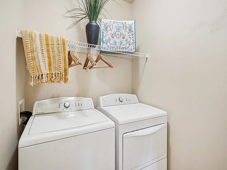 Convenient in-home washer and dryer area at Village at Broadstone Station apartments in Apex, North Carolina