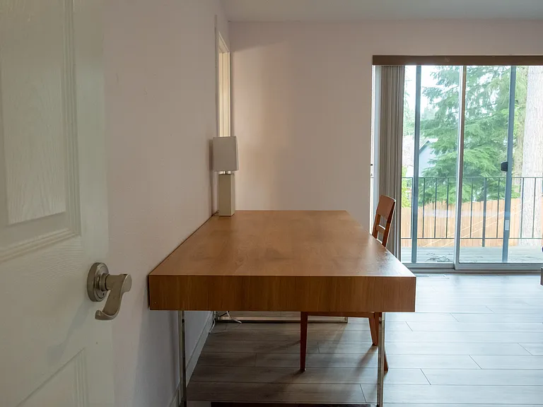 Furnished master bedroom with 80 inch desk