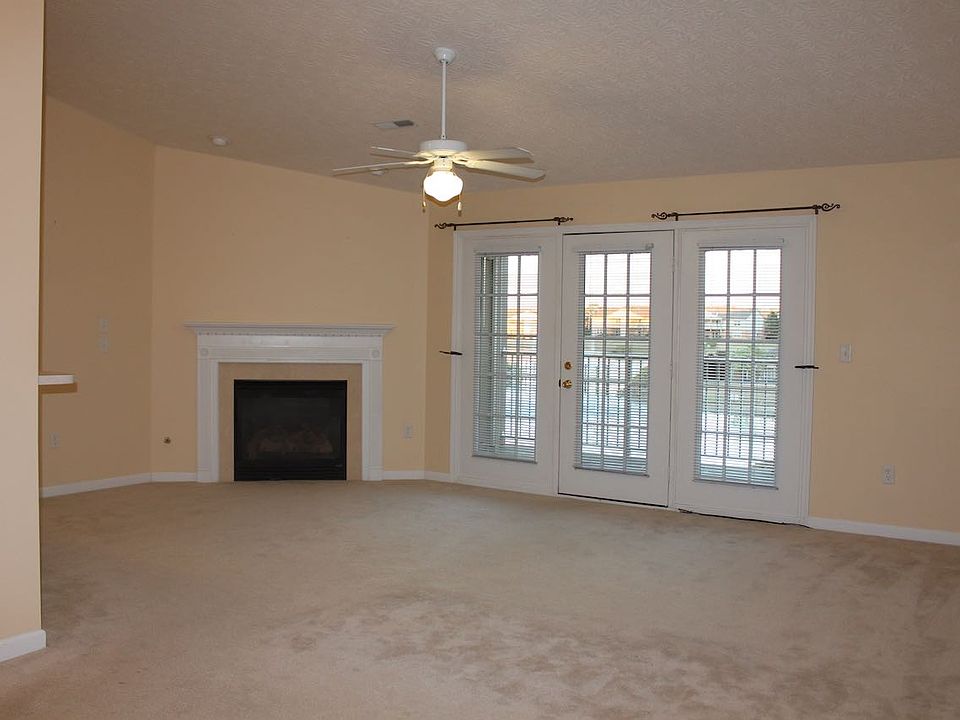 Living room, with gas fireplace and lake view.