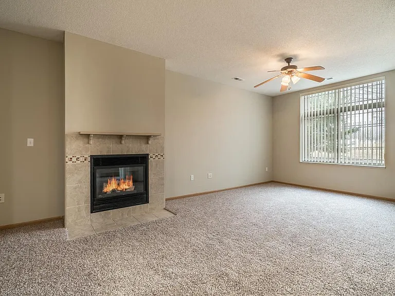 Our spacious living rooms are perfect for relaxing by the cozy fireplace, creating a warm and inviting space for everyday living.
