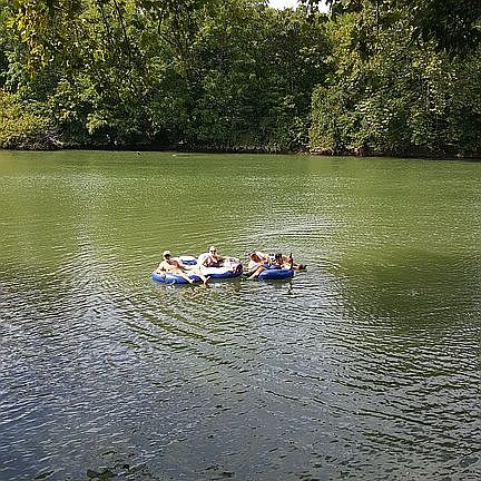 Tubers coming down the river
