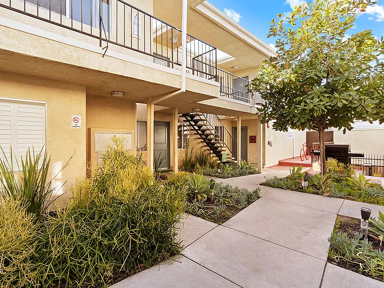 Drought resistant landscaping and barbeques in each courtyard.