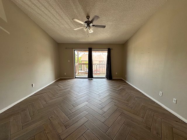 LIVING ROOM WITH SLIDING GLASS DOOR TO BALCONY