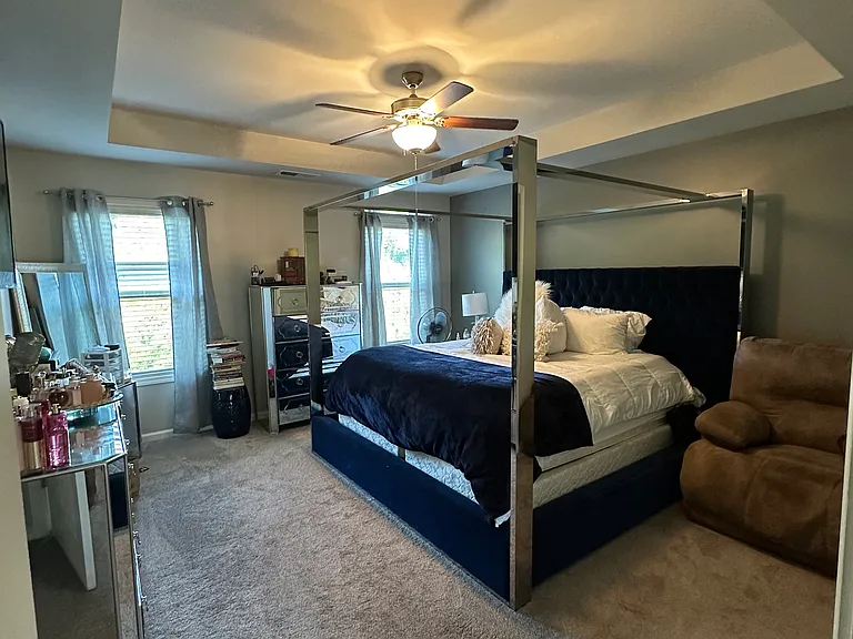 Retreat to this spacious master suite designed for rest, relaxation, and effortless style