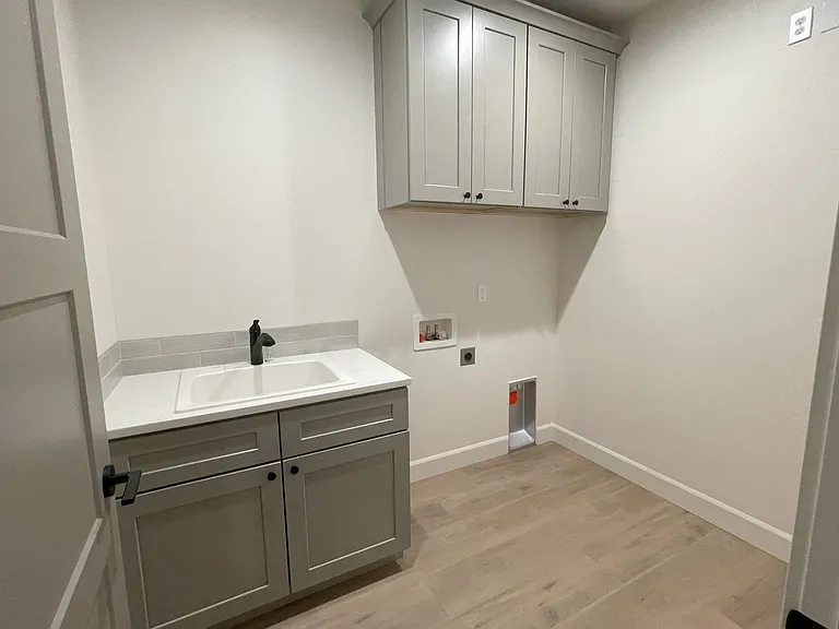 Laundry room with a large sink