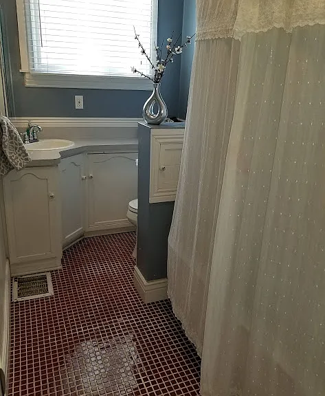 Bathroom by front office and living room