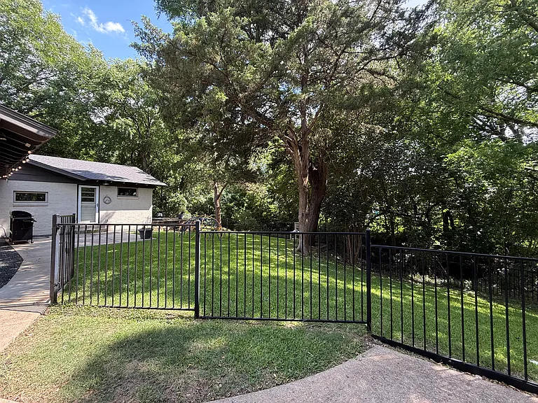 Backyard on the creek with two patio areas.
