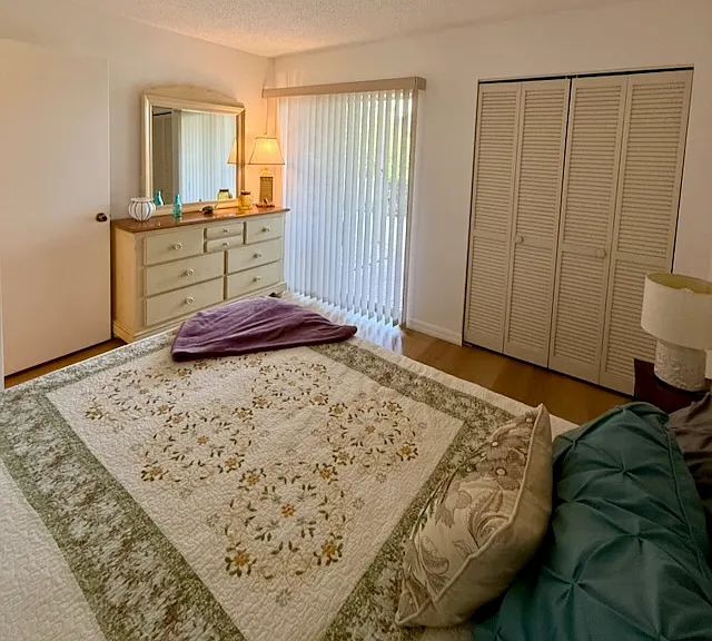 2nd bedroom with sliders to screened lanai