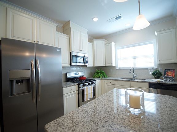 Luxury cabinets, granite, all new stainless appliances, double sinks and an 
upgraded faucet.