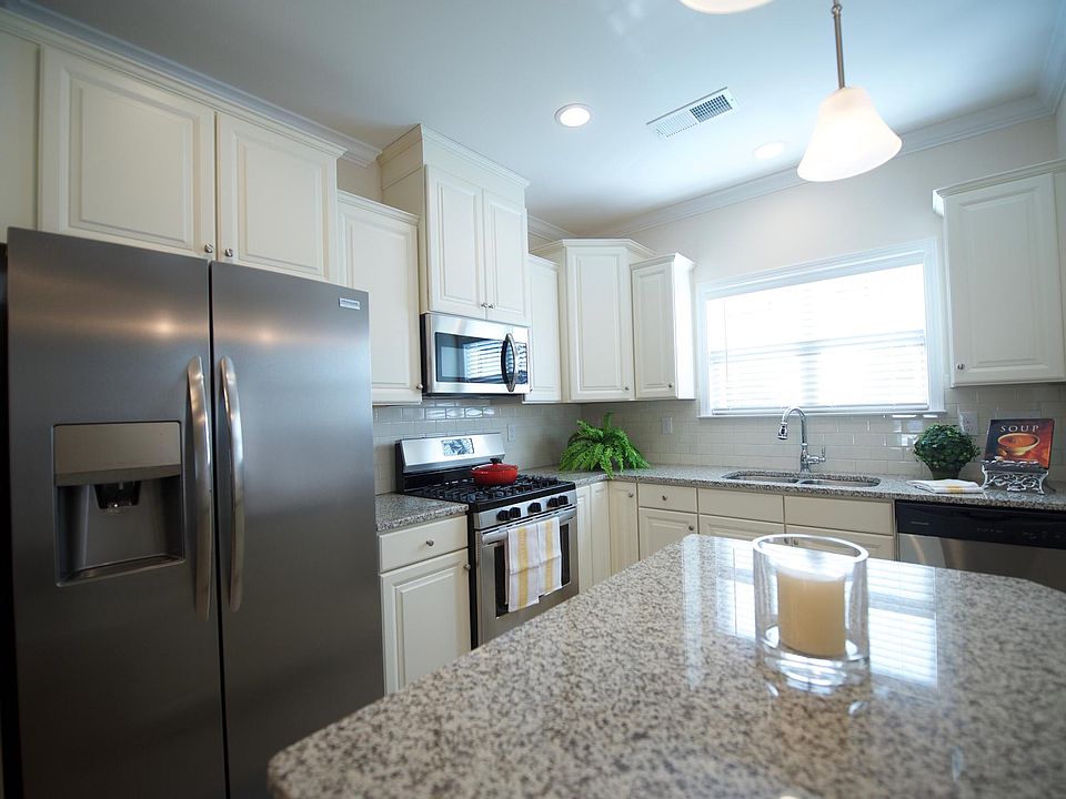 Luxury cabinets, granite, all new stainless appliances, double sinks and an 
upgraded faucet.