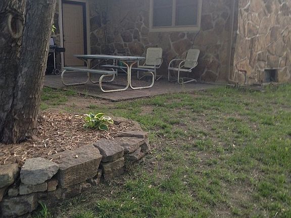 Flower garden and back patio
						:
						Lots of Shade to enjoy!