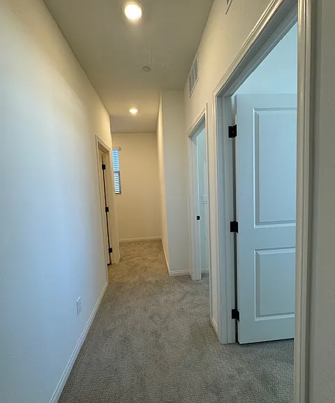 Hallway of 3 bedrooms and secondary bath
