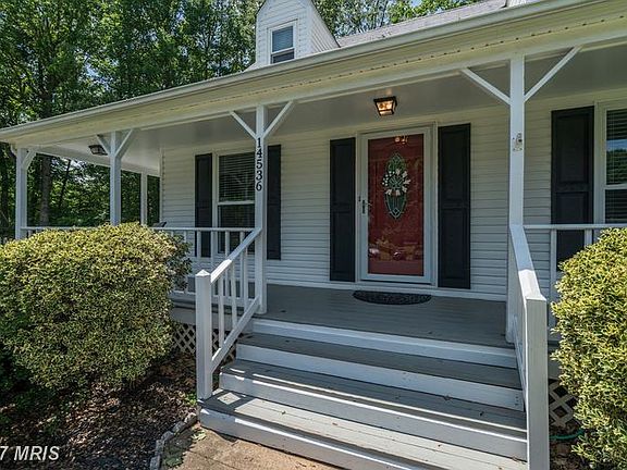 CHARMING WRAP AROUND FRONT PORCH!