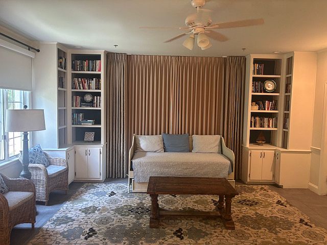 Twin bed/ cozy reading area with library