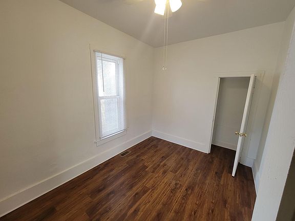 1st bedroom and closet; doorway to living room is on right