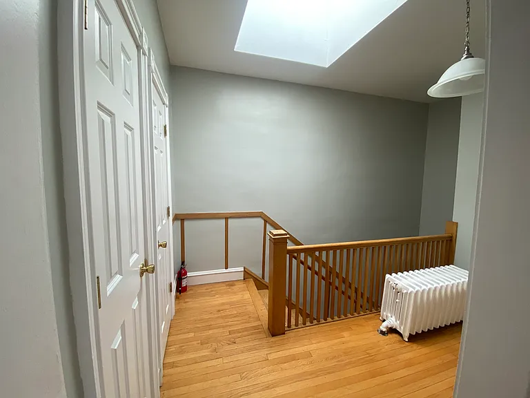 Front entrance landing - coat and shoe closets
