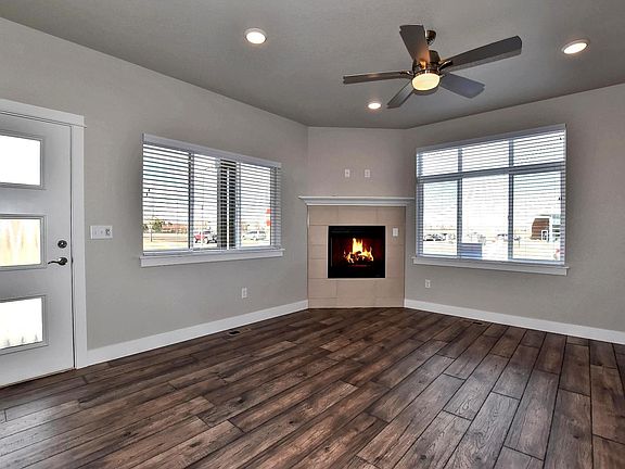 main level living room w/ fireplace and fan