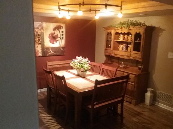 Lighted Tray ceiling and modern lights illuminate this romantic dining area.
