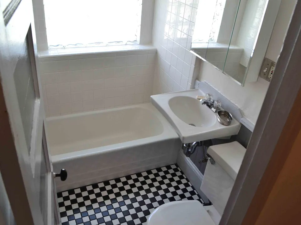 Bathroom with shower and glass brick window.