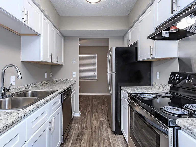 BEAUTIFUL WELL-EQUIPPED KITCHEN IN THE MAGNOLIA AT LAUREL RIDGE APARTMENTS