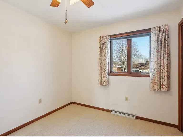 Bedroom 2. Curtains have been removed.