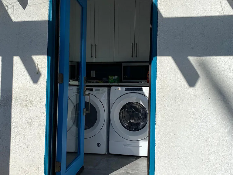 View into laundry room from backyard
