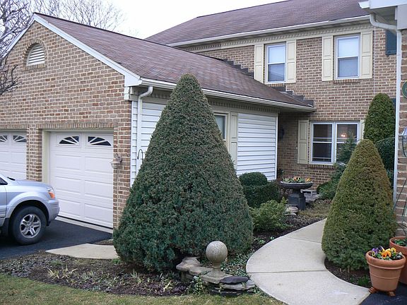 Front of home with beautiful landscaping