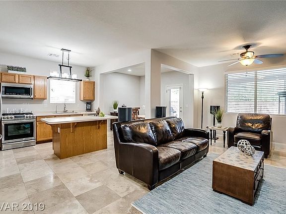 Open Kitchen and Living Room with all travertine tile on downstairs