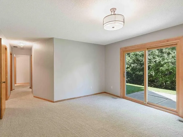 Lower level family room with door to patio area