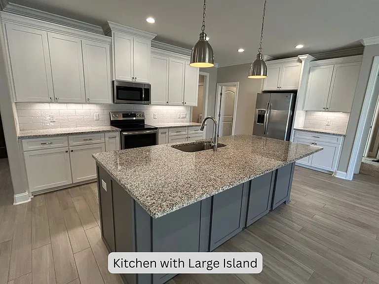 Ample storage, subway tile backsplash, under cabinet lighting