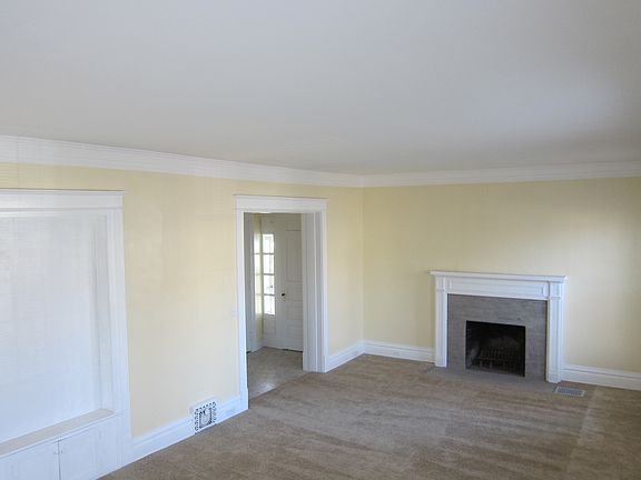 The front entry and large decorative fireplace can be seen i