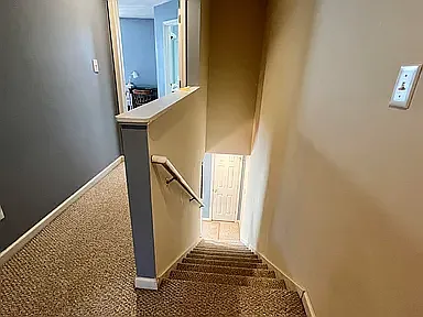 Stairs to second floor where bedrooms are located