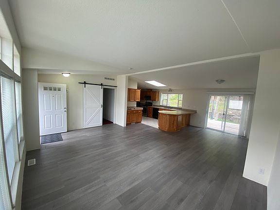 Quasi-open concept living space with a view to the Kitchen & dining area