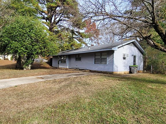 Neighborhood facing side of the home has a side entrance to access the small back yard