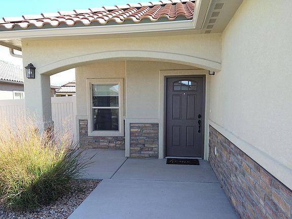 Front door. There's a perfect little area for a couple patio chairs to left of door. Cozy.