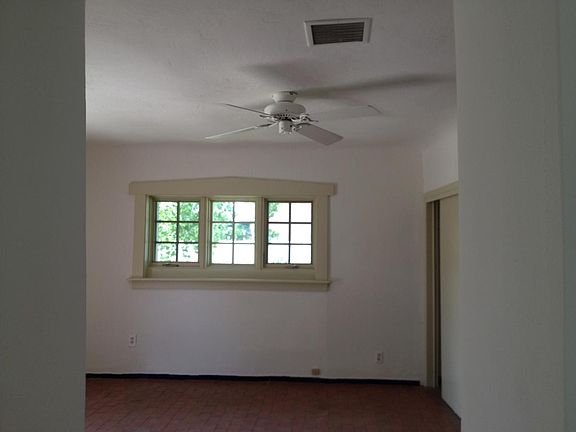 Living room window with fan.