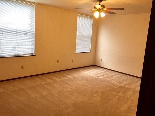 Bedroom is in the back and very large with a walk in closet