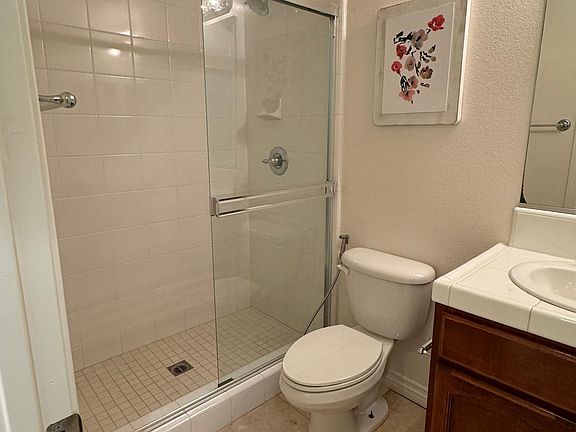 Bathroom with full standing shower.