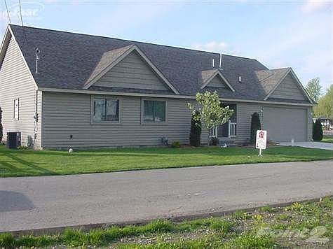 roadside view with covered entry--double lot--great lawn too