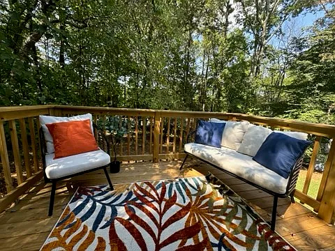 This inviting balcony offers a serene escape with breathtaking views. A comfortable couch and chair provide the perfect spot to relax and enjoy the Georgian greenery. Take in the stunning scenery while sipping your morning coffee or enjoying an cocktail
