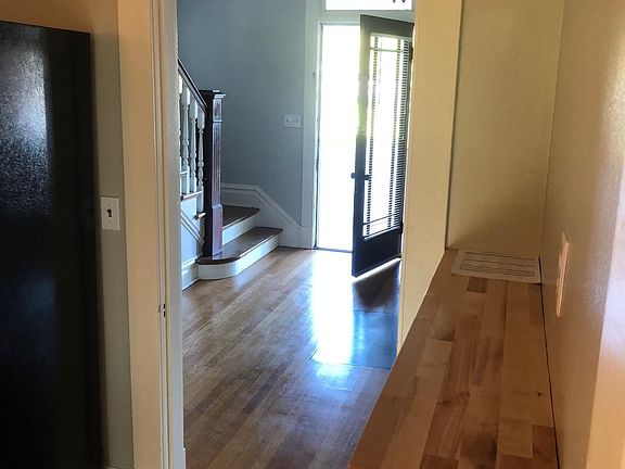 View from kitchen to entrance foyer and front door.