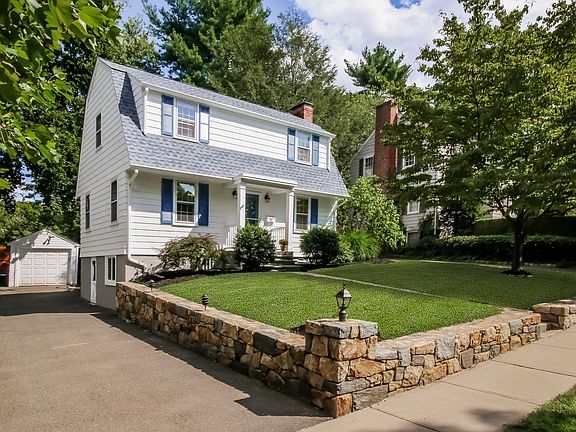 Front View of Home and Garage with Storage