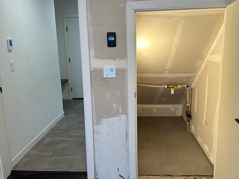 Lighted storage area in garage.