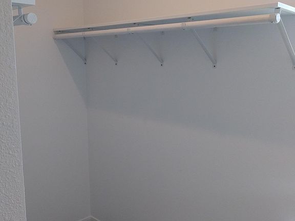 Walk in closet off bedroom
