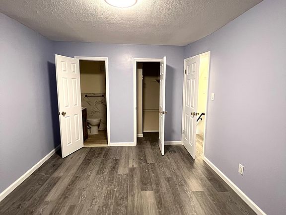 Bedroom #1 with walk-in closet and half bathroom