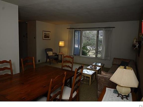 The large picture window fills this open living space with natural light.
